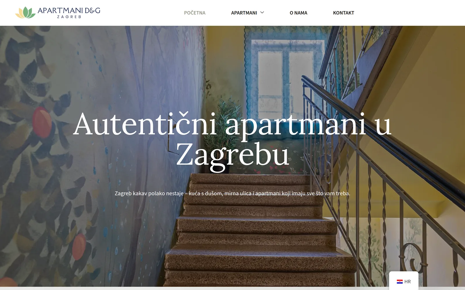 Izrada web stranice Apartmani D&G: naslovnica s oslikanim stubištem stare kuće i naslovom o autentičnim apartmanima u Zagrebu